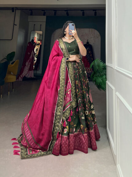 The timeless bandhani print chaniya choli showcases intricate ajrakh print and foil lacework, combining elegance and tradition in a stunning ensemble for Navratri